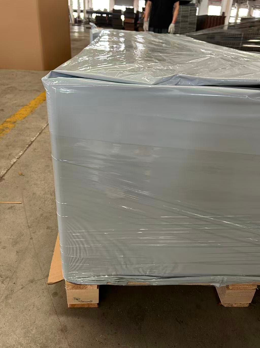 Outdoor WPC wall panels wrapped and secured on a pallet