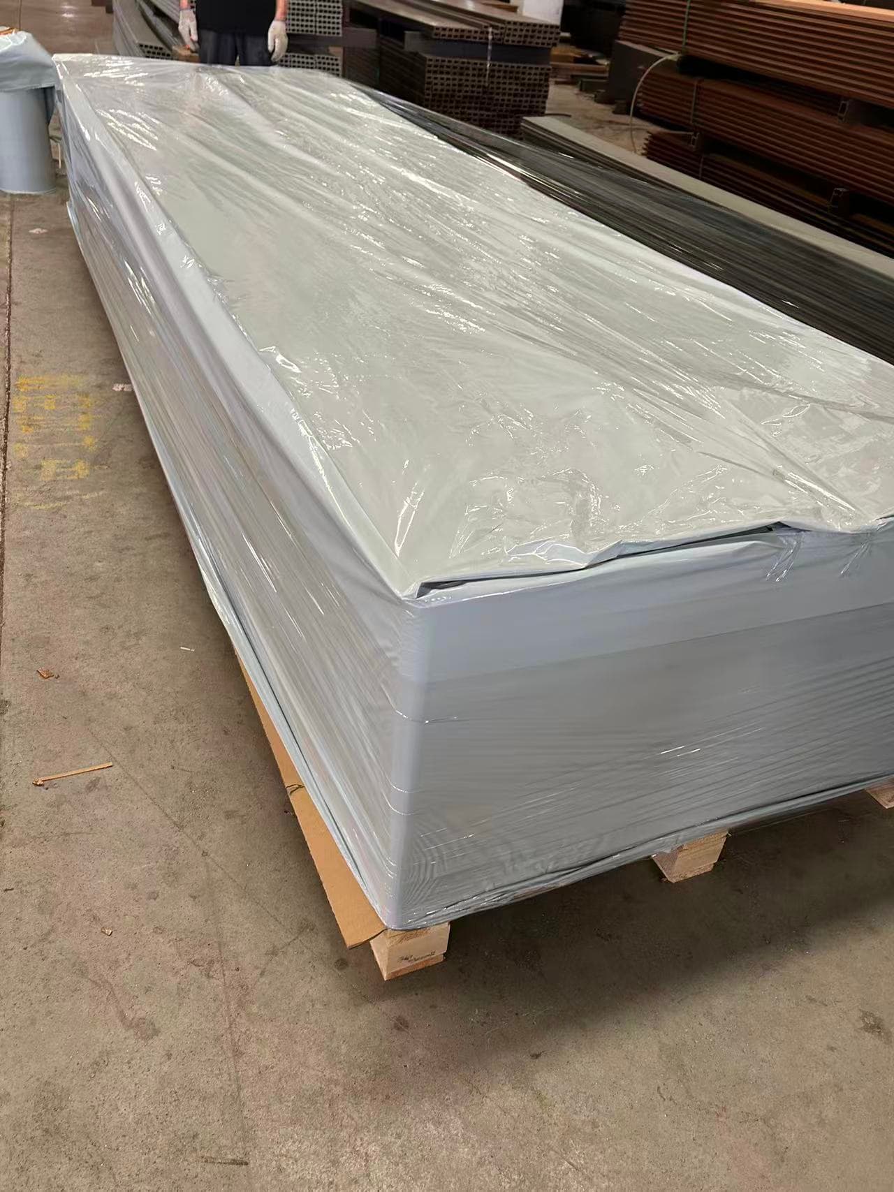 Plastic-wrapped outdoor WPC wall panels prepared for packing