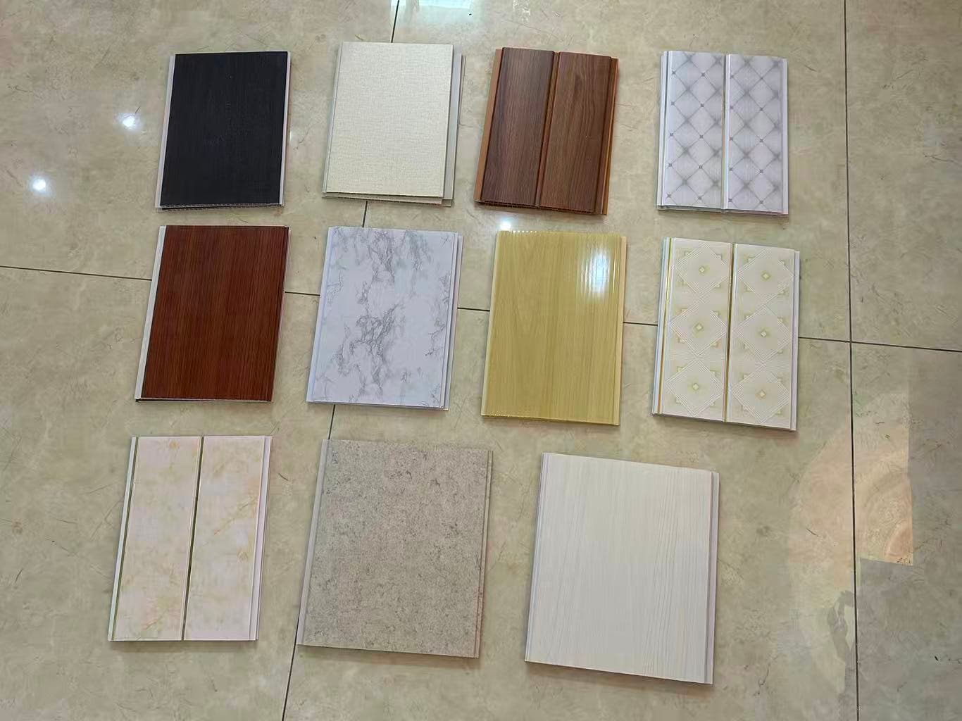 PVC ceiling panel samples in white, wood-look and decorative designs